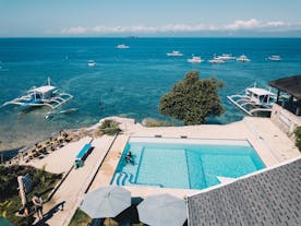 Pool of Seaview Dive Resort with an overlooking view of the ocean