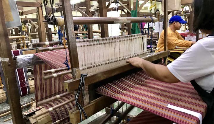 A woman weaving using a loom at Easter Weaving House in Baguio