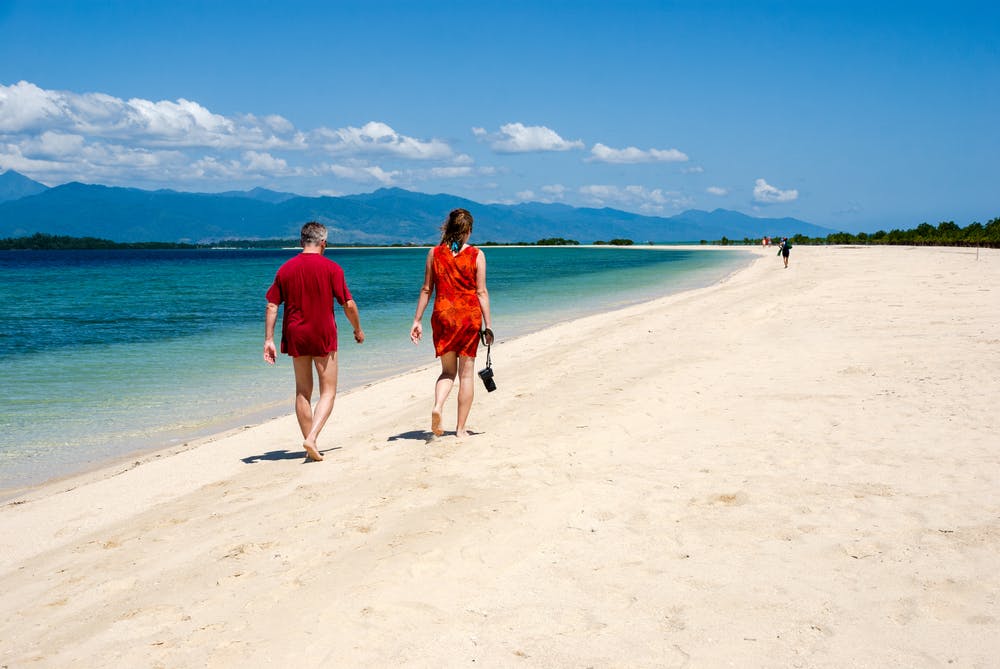 Couple walking by the beach of Honda Bay Palawan