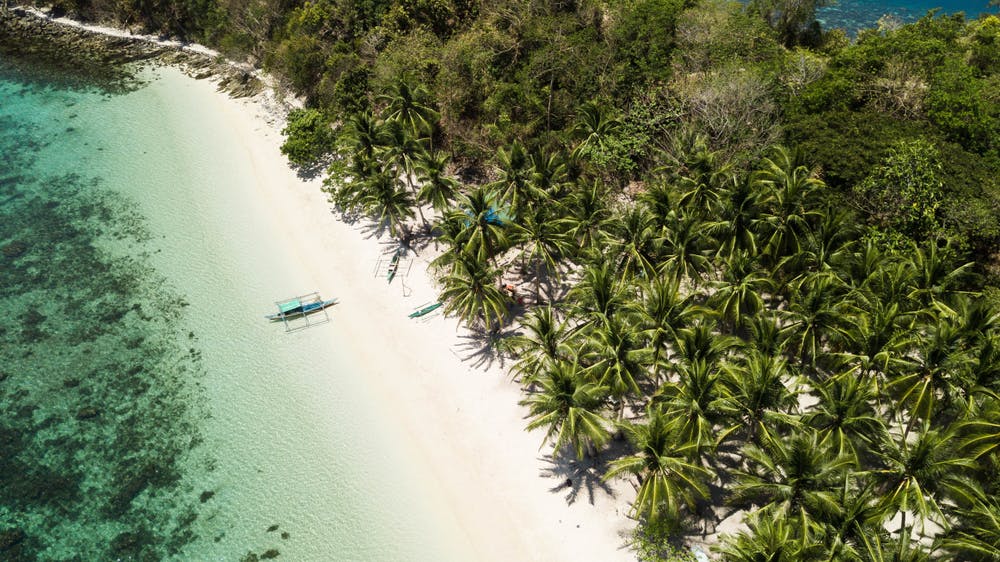 Aerial view of the white sand beach in Port Barton Palawan