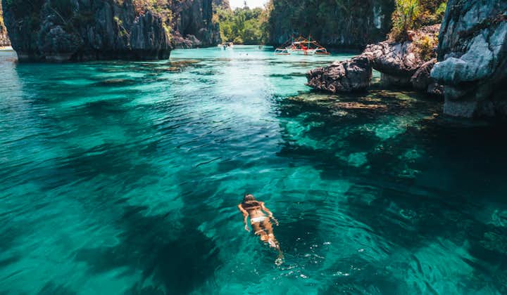 Woman enjoying the cool waters of Palawan