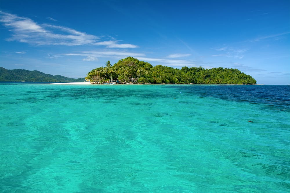 Clear blue waters of Port Barton in Palawan