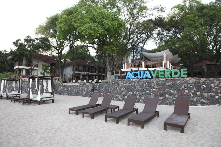 Lounge chairs on the beachfront of Acuaverde Beach Resort