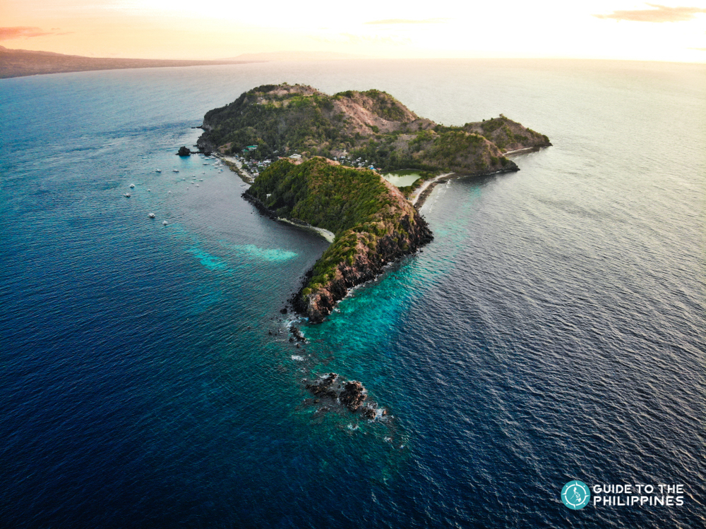 Aerial view of the beautiful Apo Island during sunset