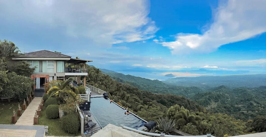 Oriental Luxury Suites' pool overlooks Taal Volcano
