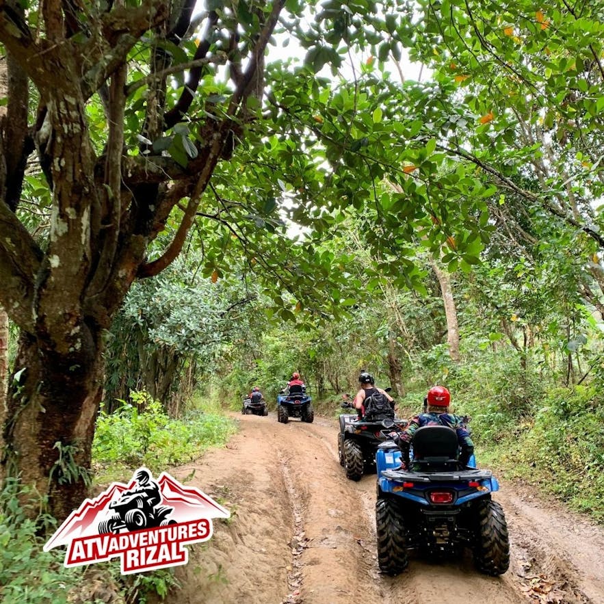 People follow a guide in ATV Adventures Rizal