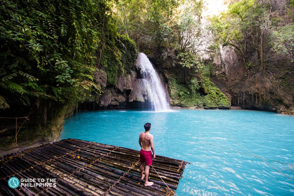 A man enjoying the view of Kawasan Falls in Cebu