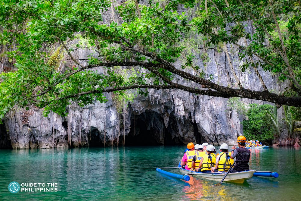 A boat of tourists going inside Puerto Princesa Underground River in Palawan