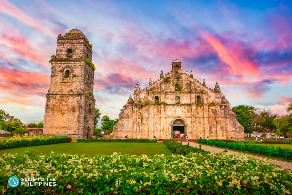 Paoay Church behind colorful sunset skies in Laoag