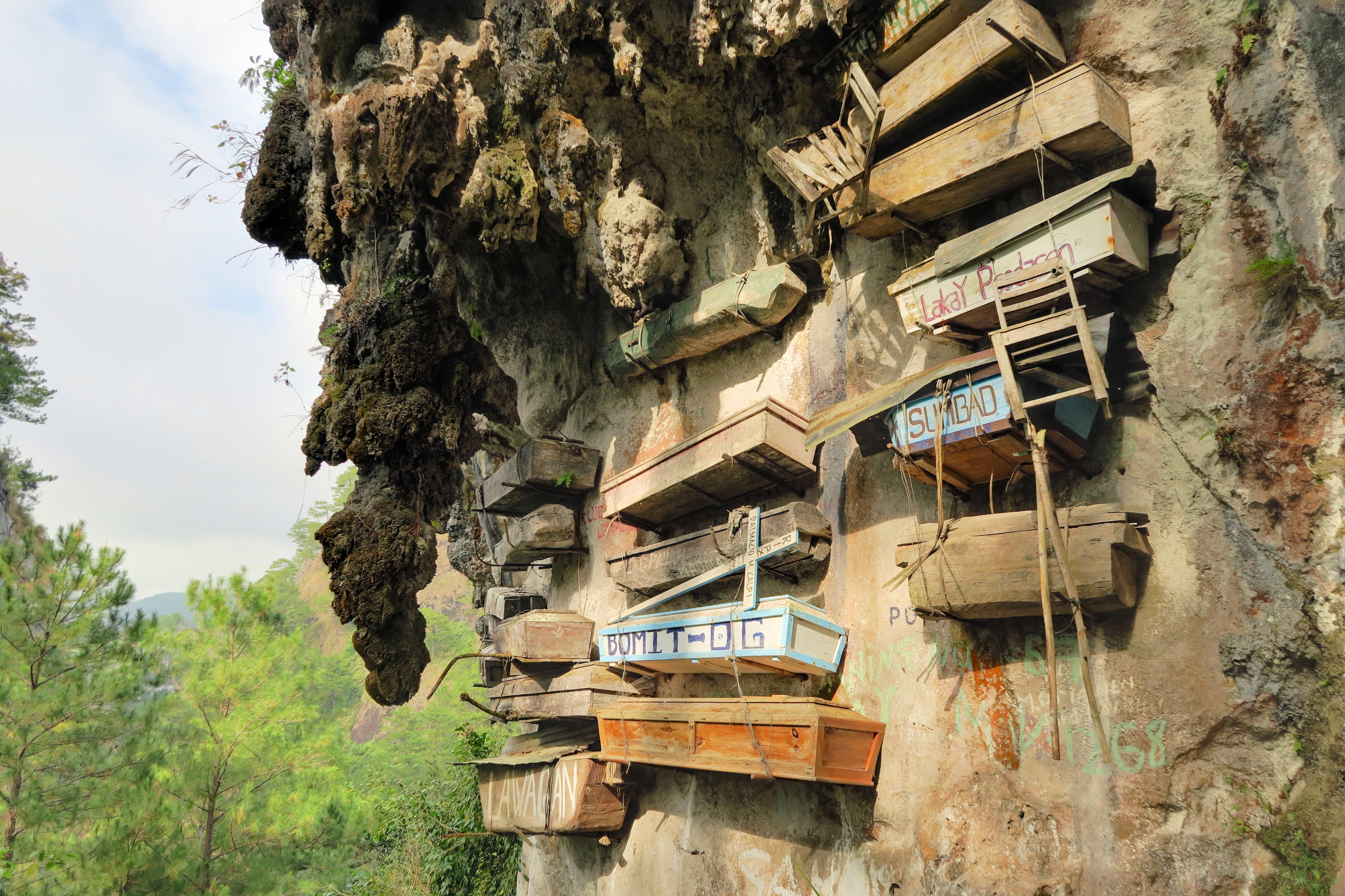 Hanging Coffins of Sagada outside a cave