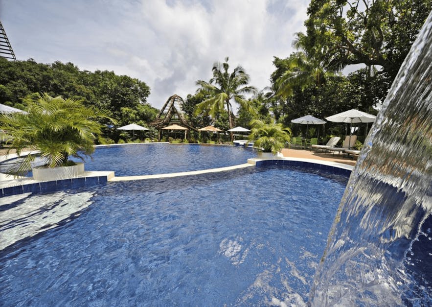 The pool area of Oldwoods by The Sea Nature Resort