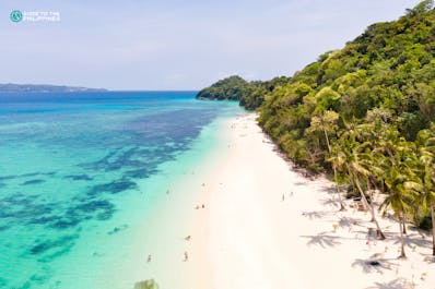 Clear blue waters and white sand at Puka Beach in Boracay