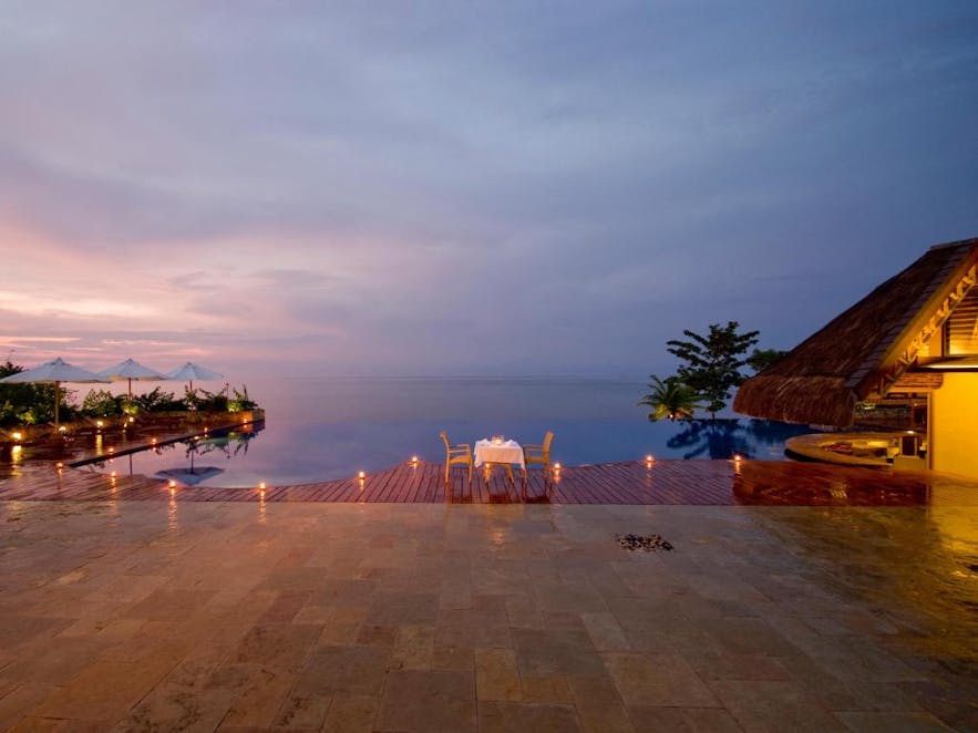 Romantic dinner by Eskaya Beach Resort & Spa's pool