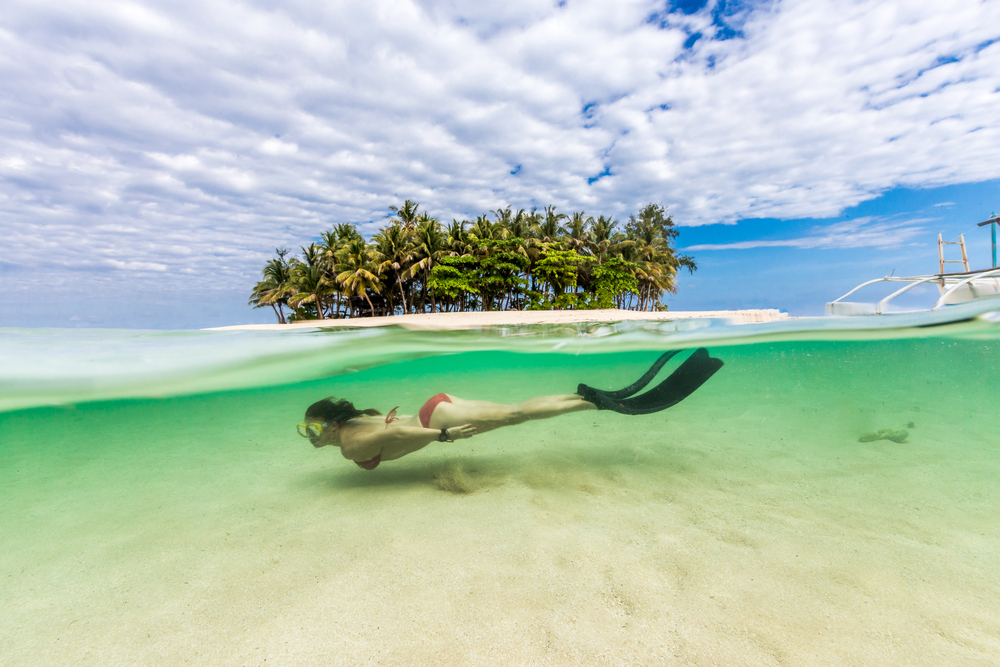 Bring your fins and swim around Guyam Island