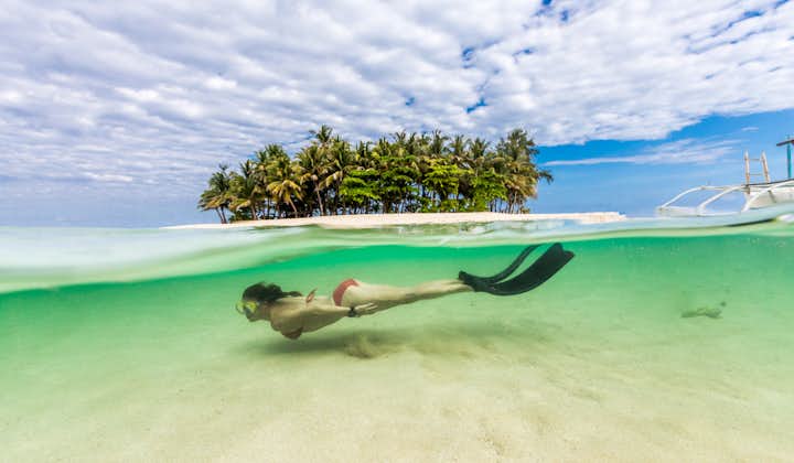 Bring your fins and swim around Guyam Island
