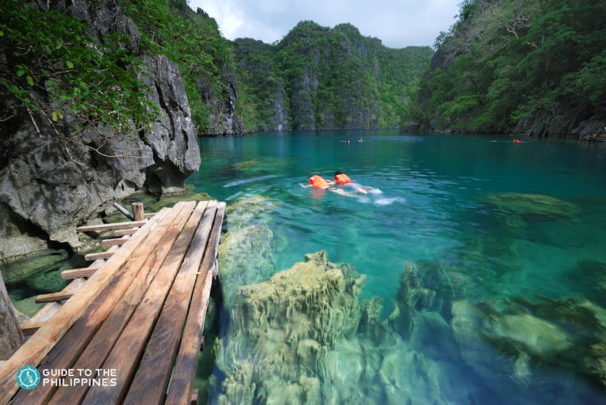 People swimming in Kayangan Lake, Palawan