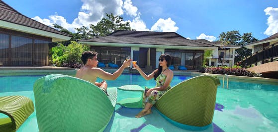 Couple enjoying at TAG Resort swimming pool
