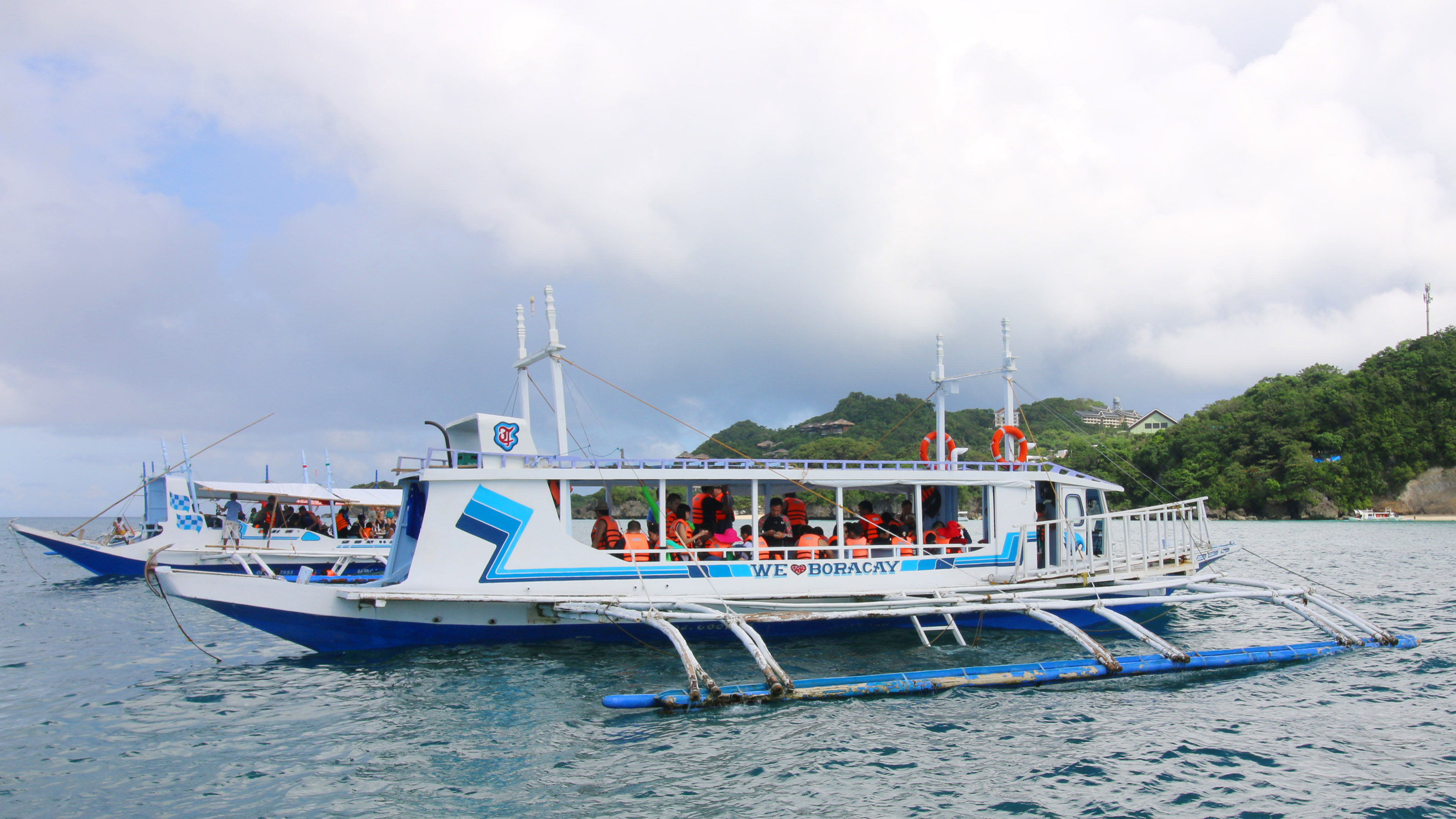 Boat of Tourists during a Boracay Island Hopping Shared Tour with Guide and Barbeque Lunch