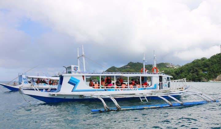 Boat of Tourists during a Boracay Island Hopping Shared Tour with Guide and Barbeque Lunch