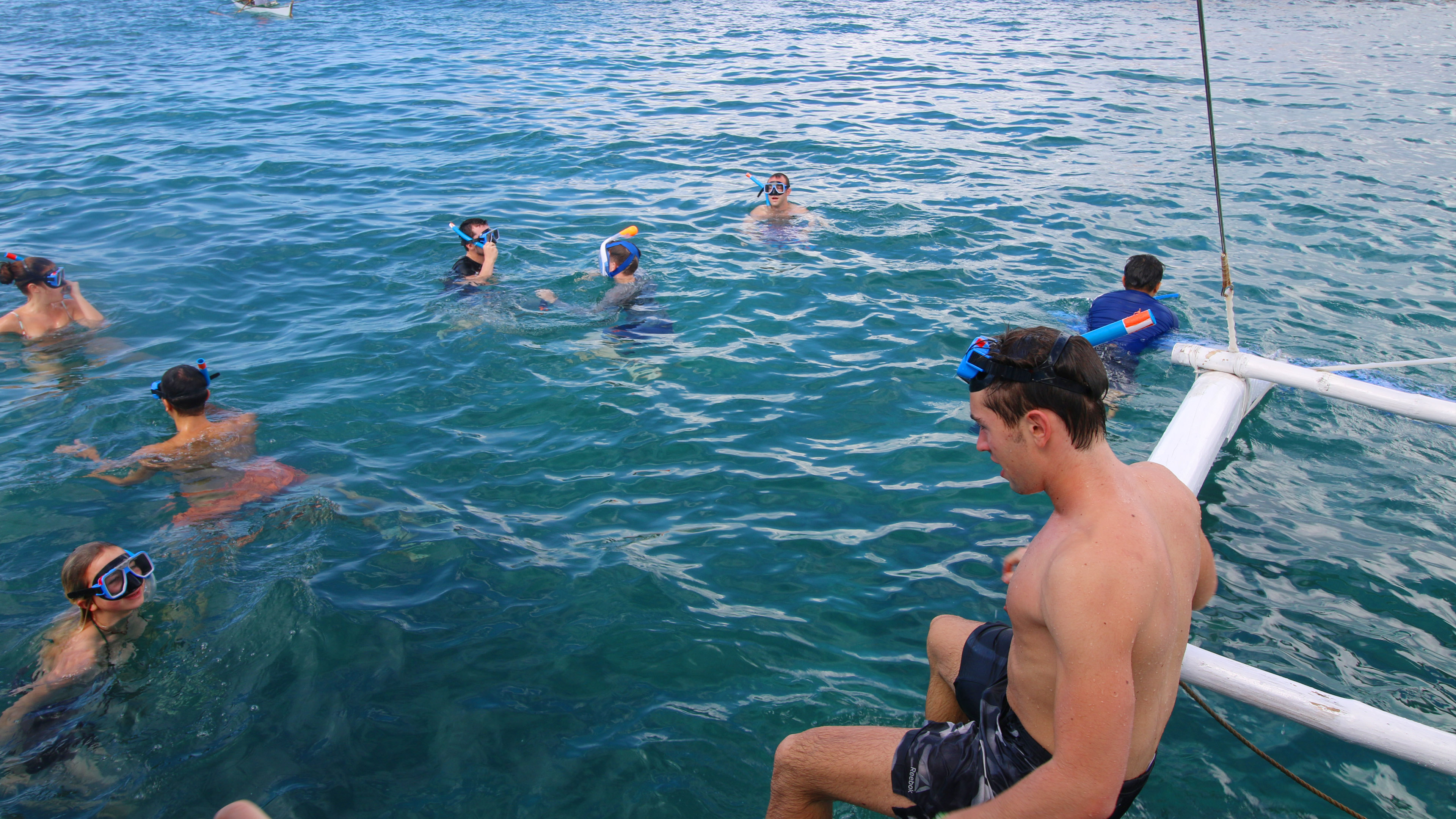 Tourists participating in Snorkeling Activities for the Boracay Island Hopping Private Tour with free Snorkeling Gear