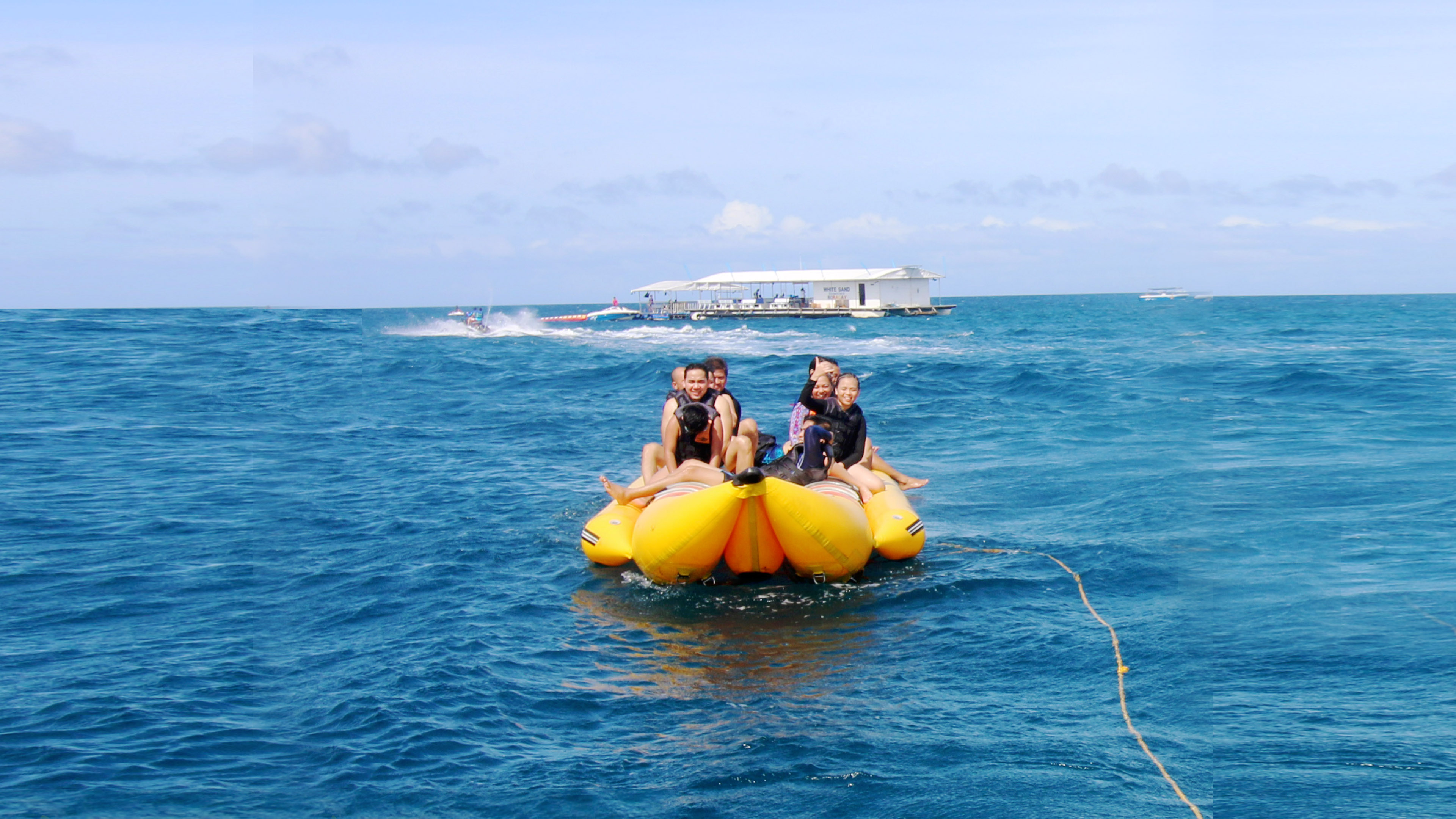 Tourists enjoying the Banana Boat Adventure in Boracay