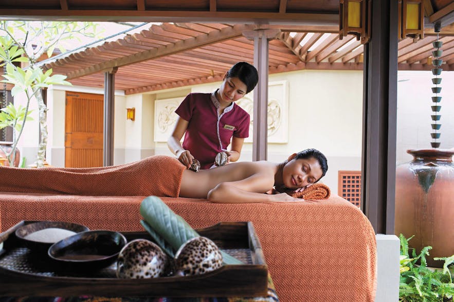 Woman getting a massage in Boracay Shangri-La's CHI Spa