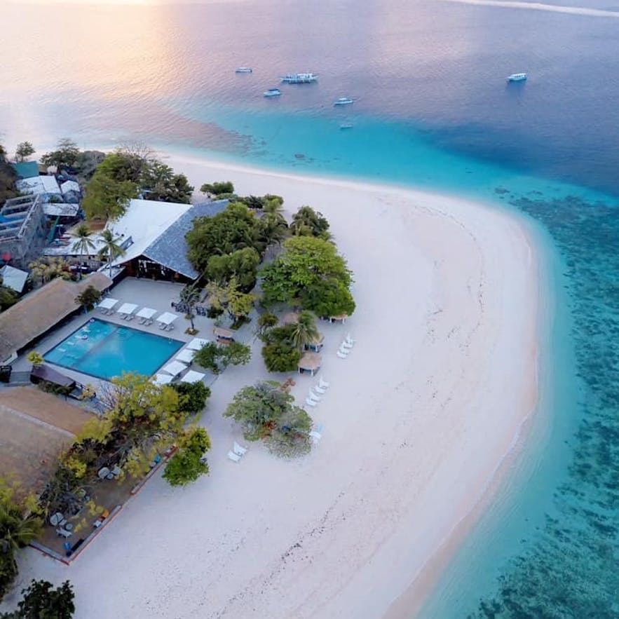 Aerial view of Club Paradise's beachside pool