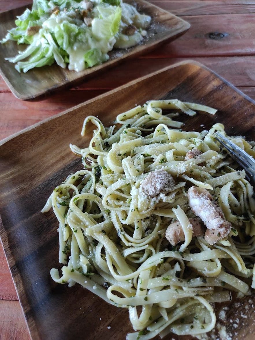 Pesto Pasta paired with leafy green salad