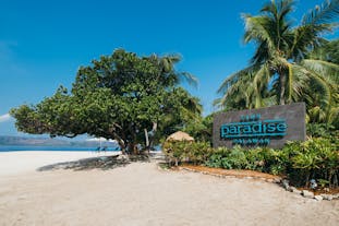 Signage of Club Paradise found at the entrance of the Resort