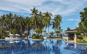 Garden and a pool area at Movenpick Resort and Spa, Boracay