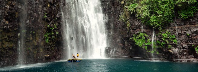 TopBannerPeople floating on raft by the Tinago Falls.jpg