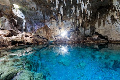 Be amazed with the deep lagoon at Hinagdanan Cave