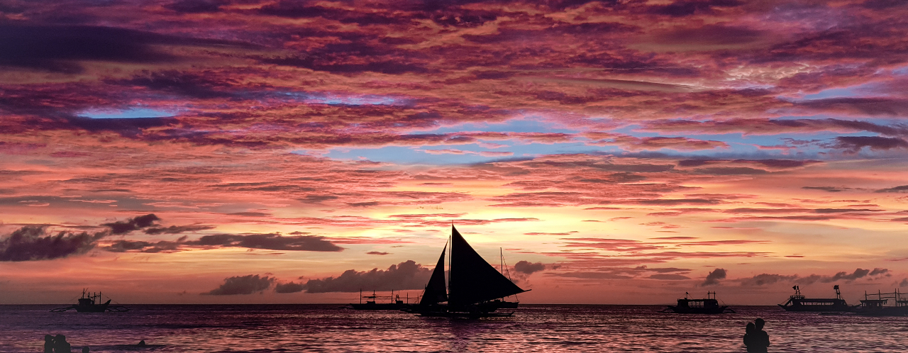private romantic sunset vibe while paraw sailing in boracay