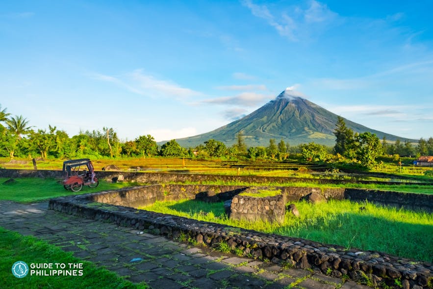 Tricycle stops near Mayon Volcano
