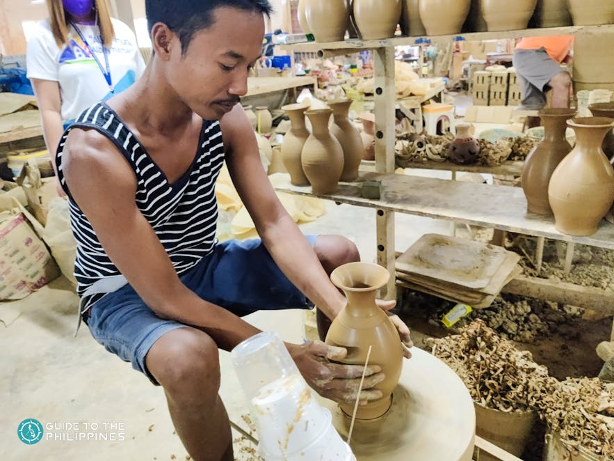 Man making a vase in PhilCeramics Arts and Crafts Center