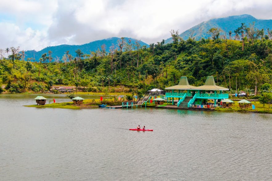 Travelers kayaking on Danao Lake