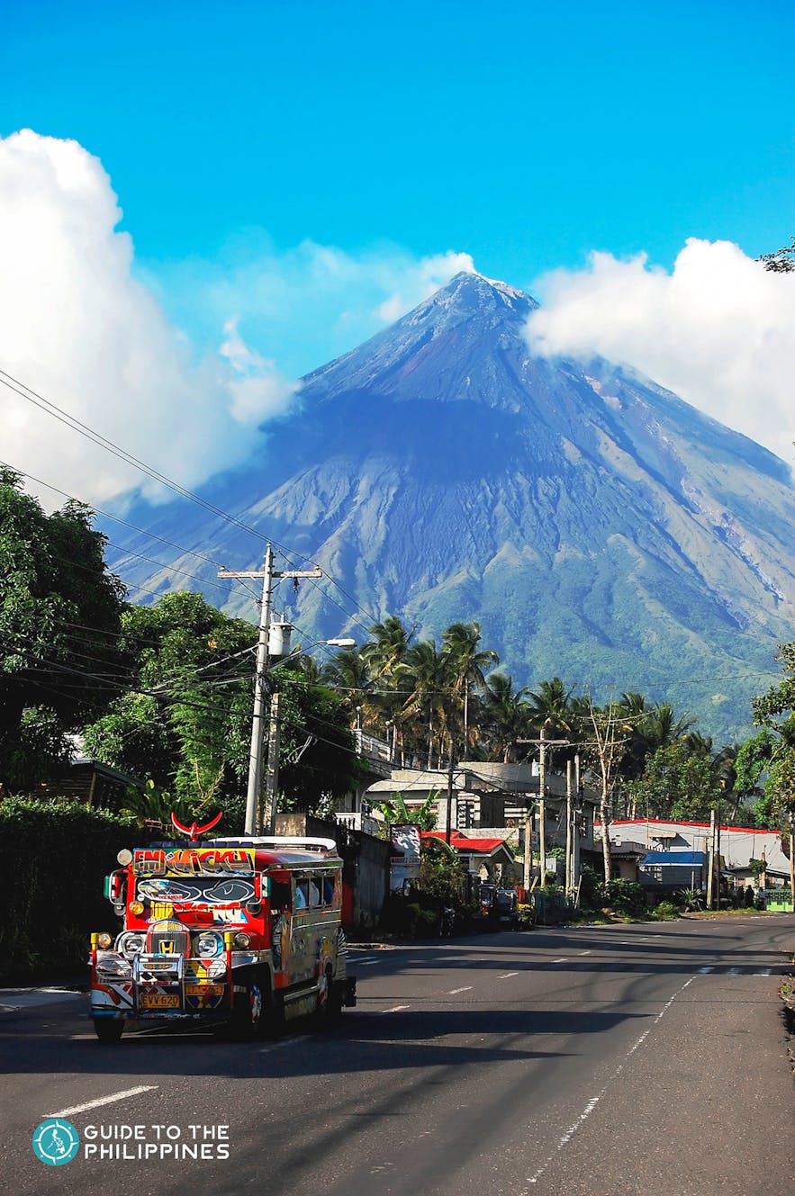 Jeepney passing by Mayon Volcano