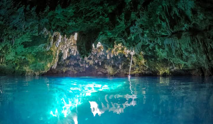 Swim inside Cabagnow Cave's turquoise waters