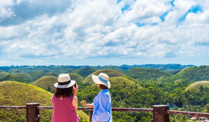 Guests at the Chocolate Hills view deck