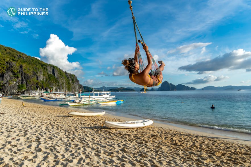 Woman swinging at Seven Commandos Beach