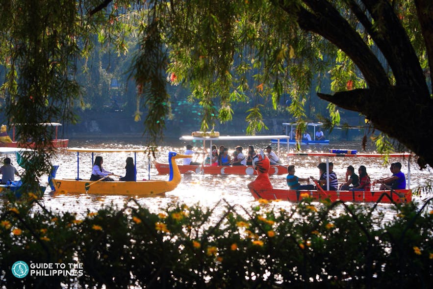 Tourists riding boats in Burhnam Park, Baguio