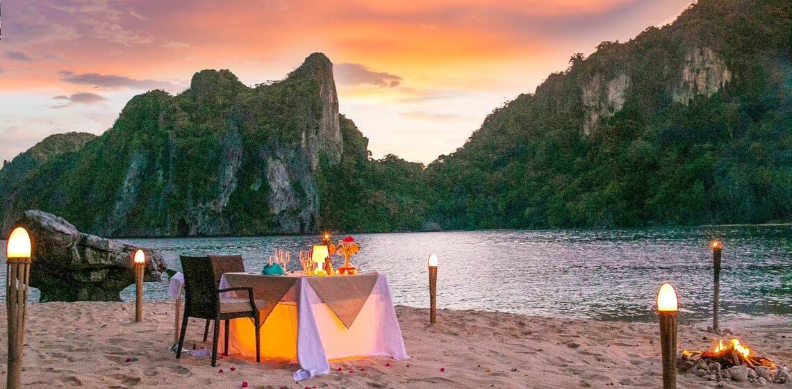Romantic private dinner by the beach at Cauayan Island Resort El Nido