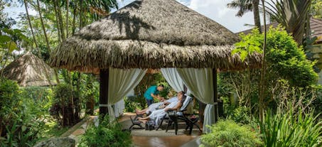 Couple enjoying a tranquil outdoor treatment at Nurture Wellness Village, Tagaytay