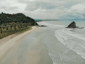 Pristine white sand long coast of San Vicente, Palawan