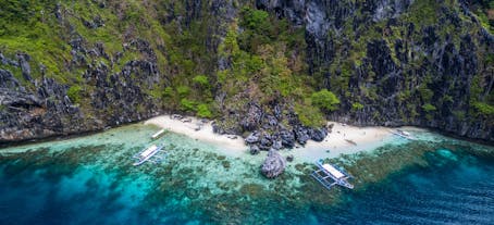 Take a picture and swim at the Secret Beach El Nido Palawan