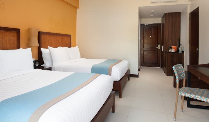 Get comfortable at the Deluxe room of Bacau Bay Resort Coron Palawan