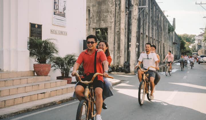 Travelers biking inside Intramuros