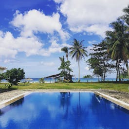 Pool overlooking the long beach at Lazuli Resort, San Vicente, Palawan