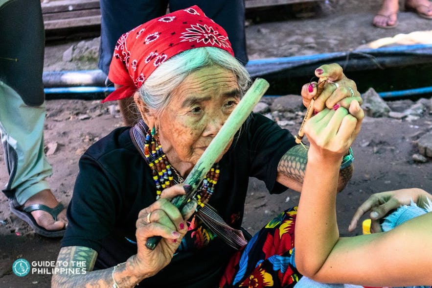 Getting a tattoo from Apo Whang-Od