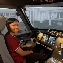 Kid enjoying a 1-hour flight simulator experience in Manila